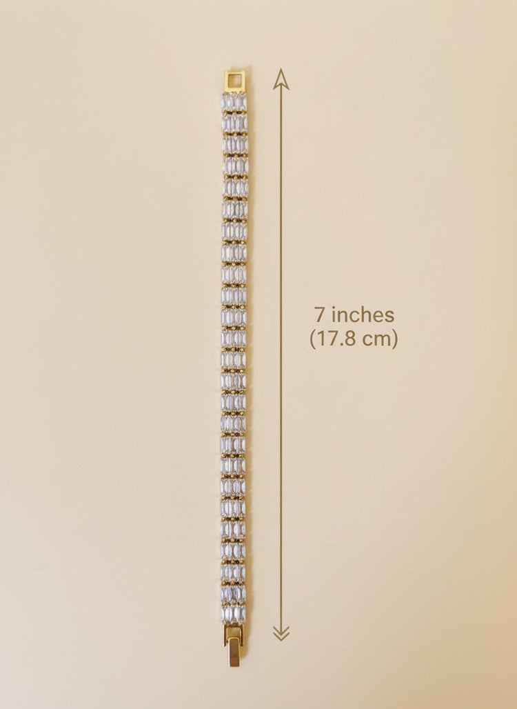 Bracelet with clear stones on a reflective surface