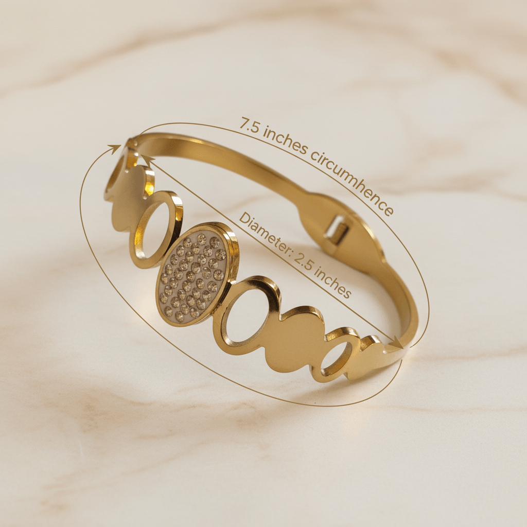 Gold bracelet with measurement details on a beige background