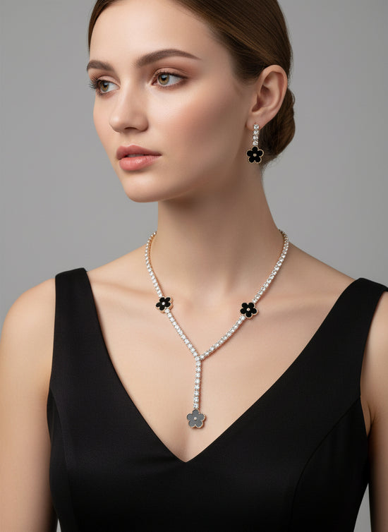 Woman wearing a pearl necklace and earrings on a gray background
