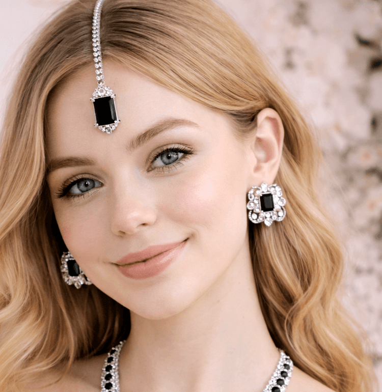 Woman wearing black and silver jewelry set with floral background