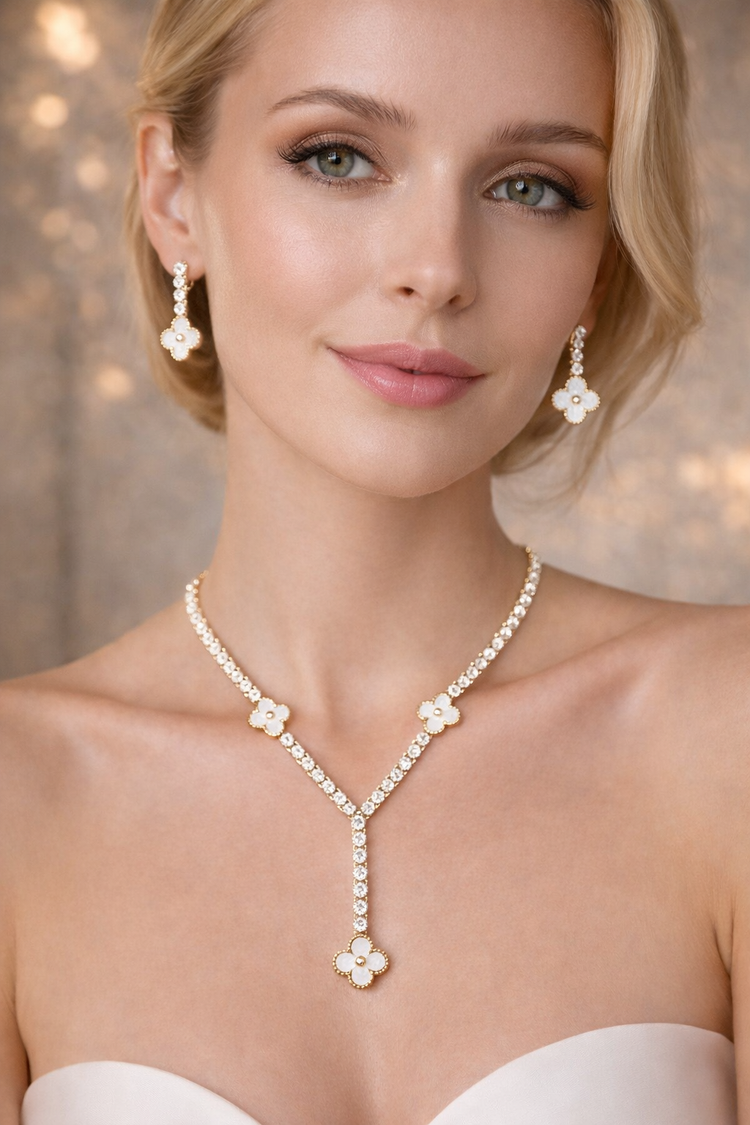 Woman wearing a pearl necklace and earrings with a soft focus background