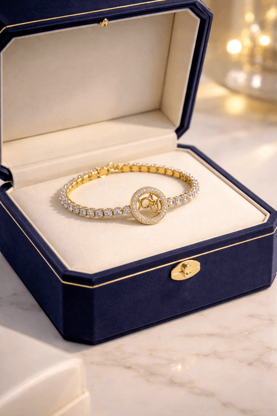 Gold bracelet with diamonds in a blue jewelry box on a marble surface