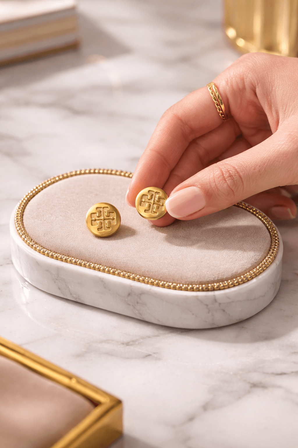 Close-up of gold stud earrings with secure back, stylish jewelry for women