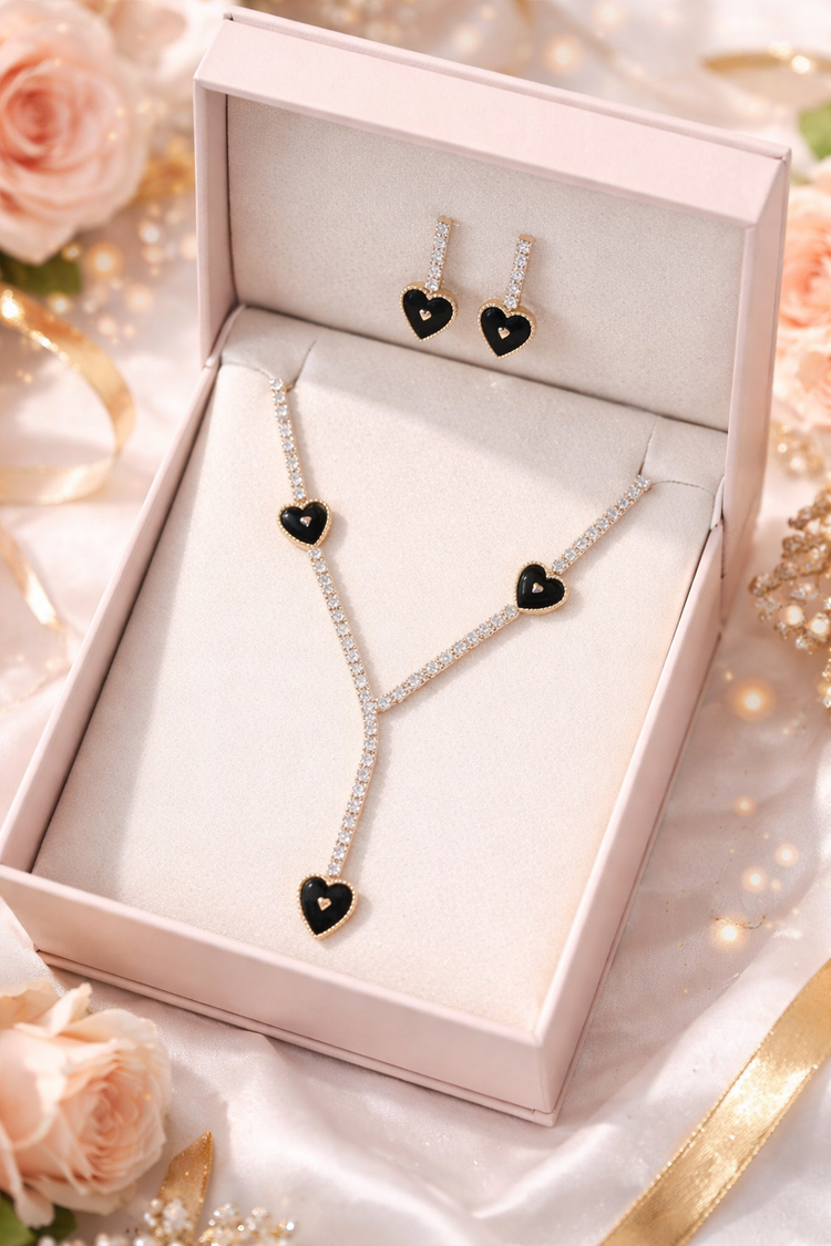 Jewelry set with necklace and earrings in a box on a decorative background