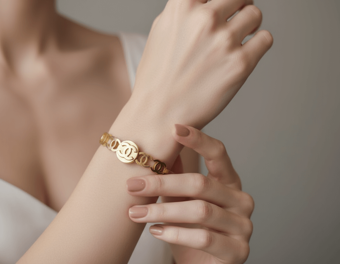 Gold bracelet on a black stand with blurred background