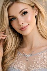 Woman wearing a silver necklace with a delicate pendant