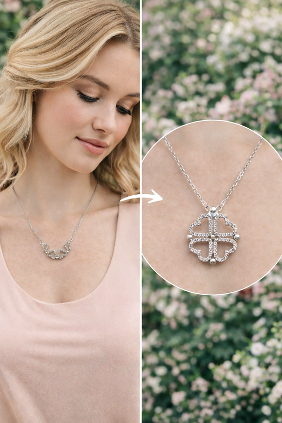 Woman wearing a silver necklace with a detailed pendant against a blurred floral background