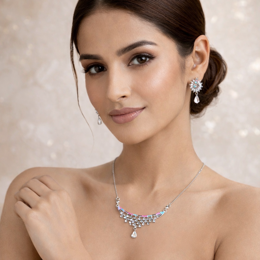 Woman wearing a necklace and earrings with a soft background
