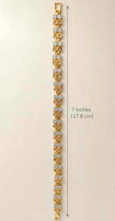 Gold bracelet with floral design and measurements on a beige background