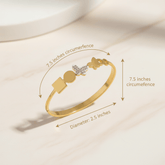 Gold bracelet with measurements on a light background