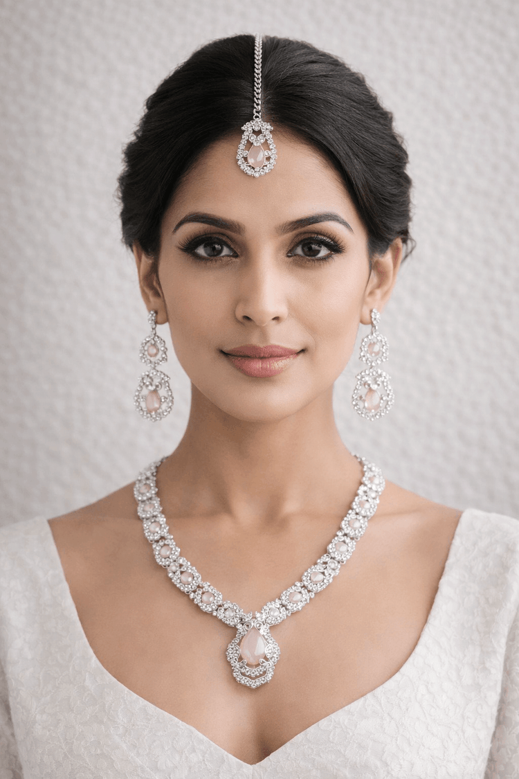 Woman wearing a luxurious diamond necklace and earrings on a neutral background