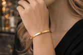 Gold bracelet on a person&