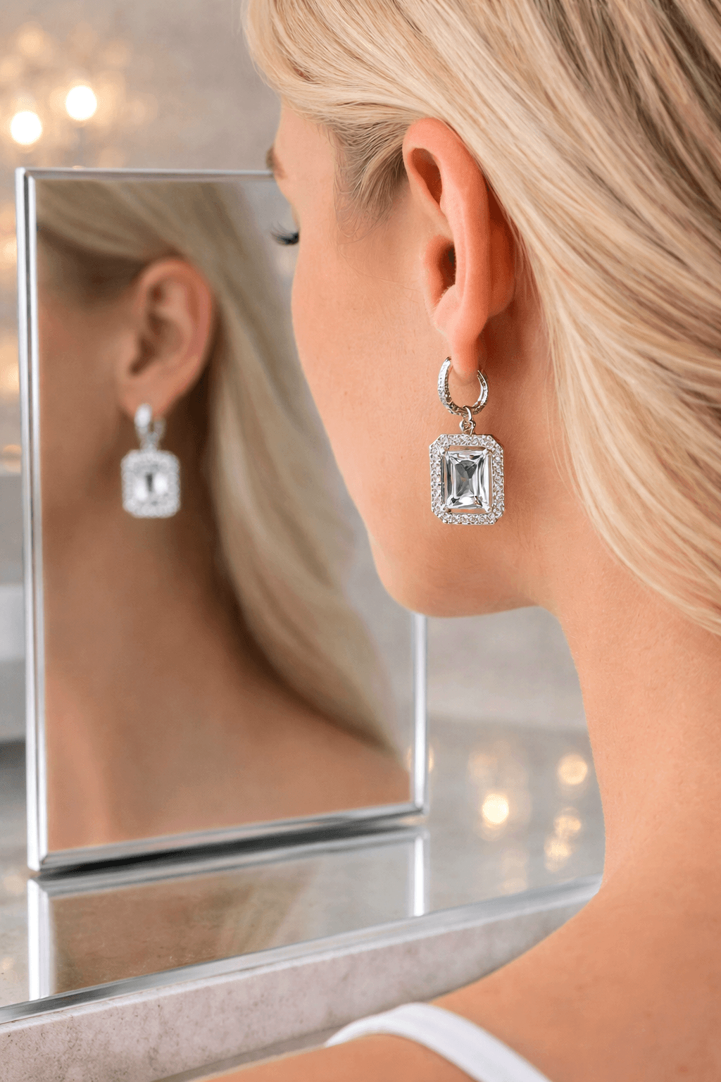 Silver and crystal rectangular drop earrings with halo design