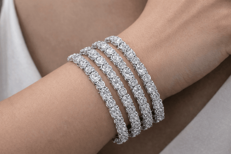Three diamond bracelets on a person&