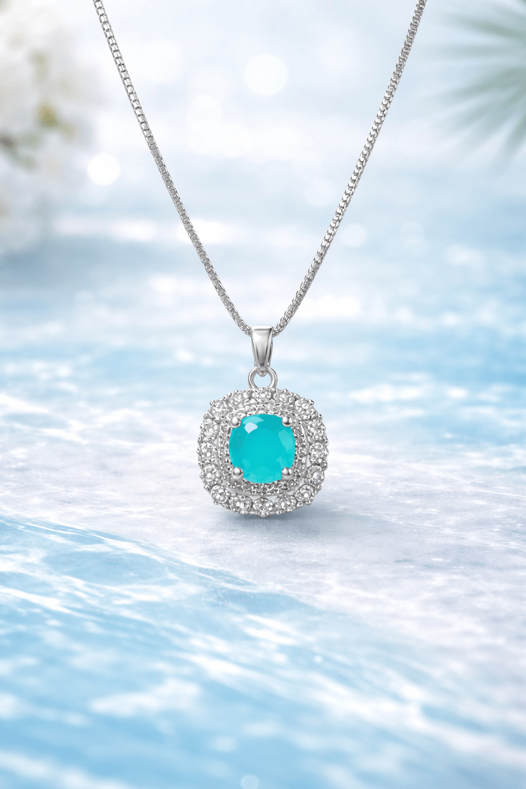 Silver necklace with a turquoise pendant on a light blue background