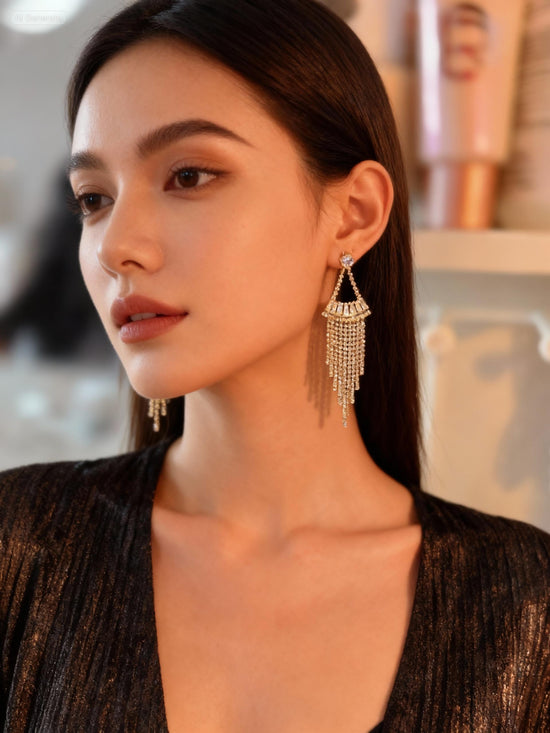Woman wearing elegant earrings with a blurred background
