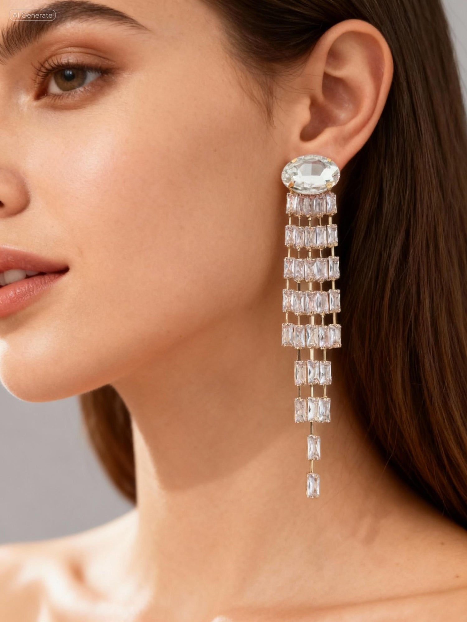 Close-up of a woman wearing a sparkling earring with a gray background